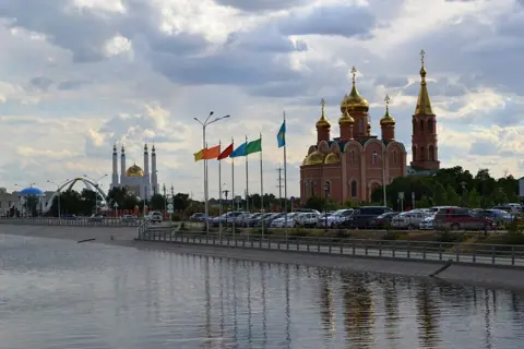Aktobe, Kazakhstan — St. Nicolas Cathedral Aktobe and Nur Ghasyr mosque