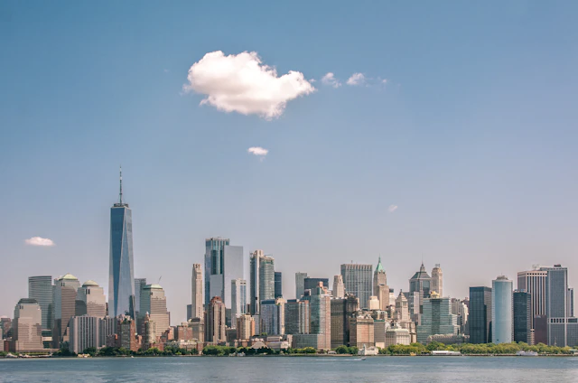The New York City skyline across the water in the United States